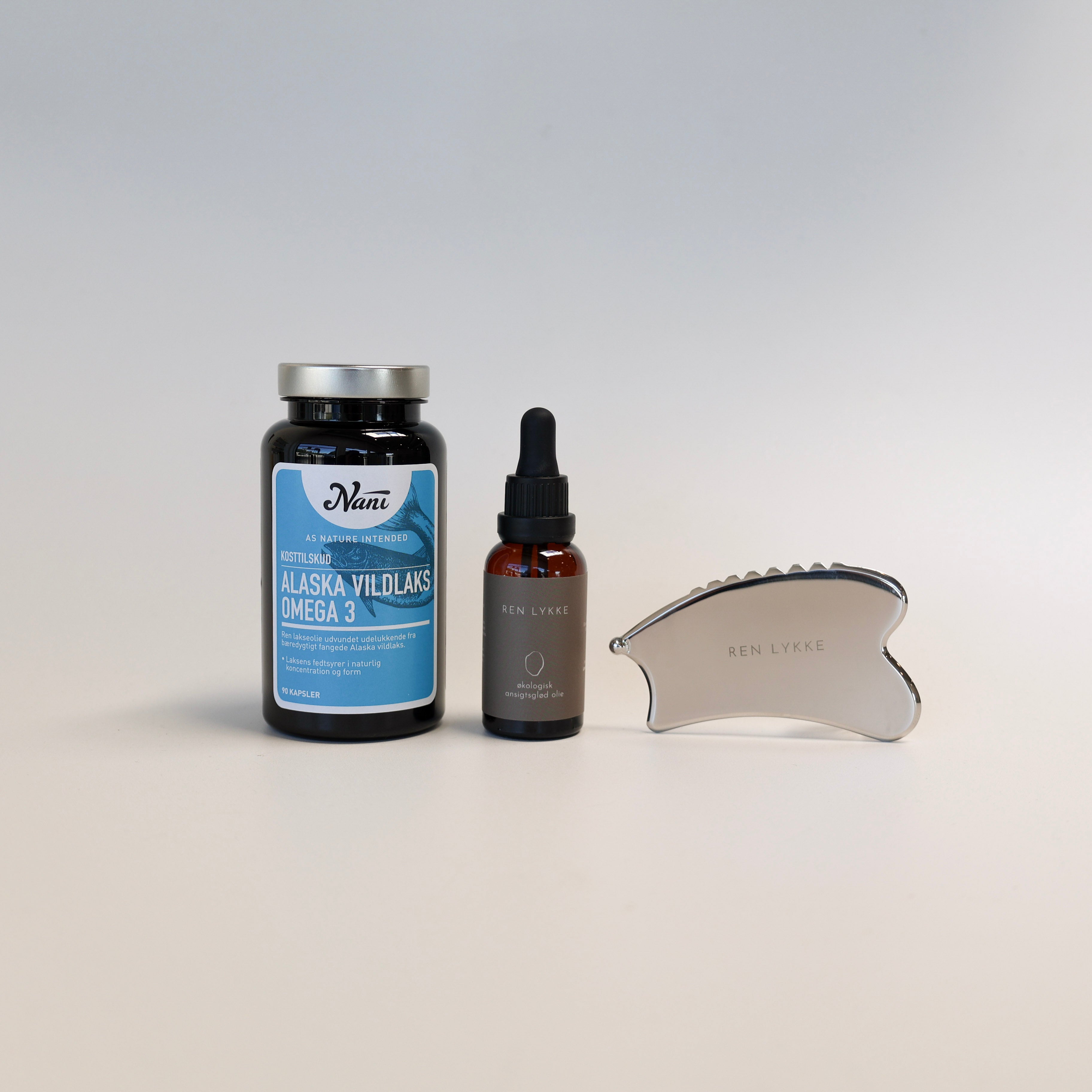 pakke med gua sha og olie