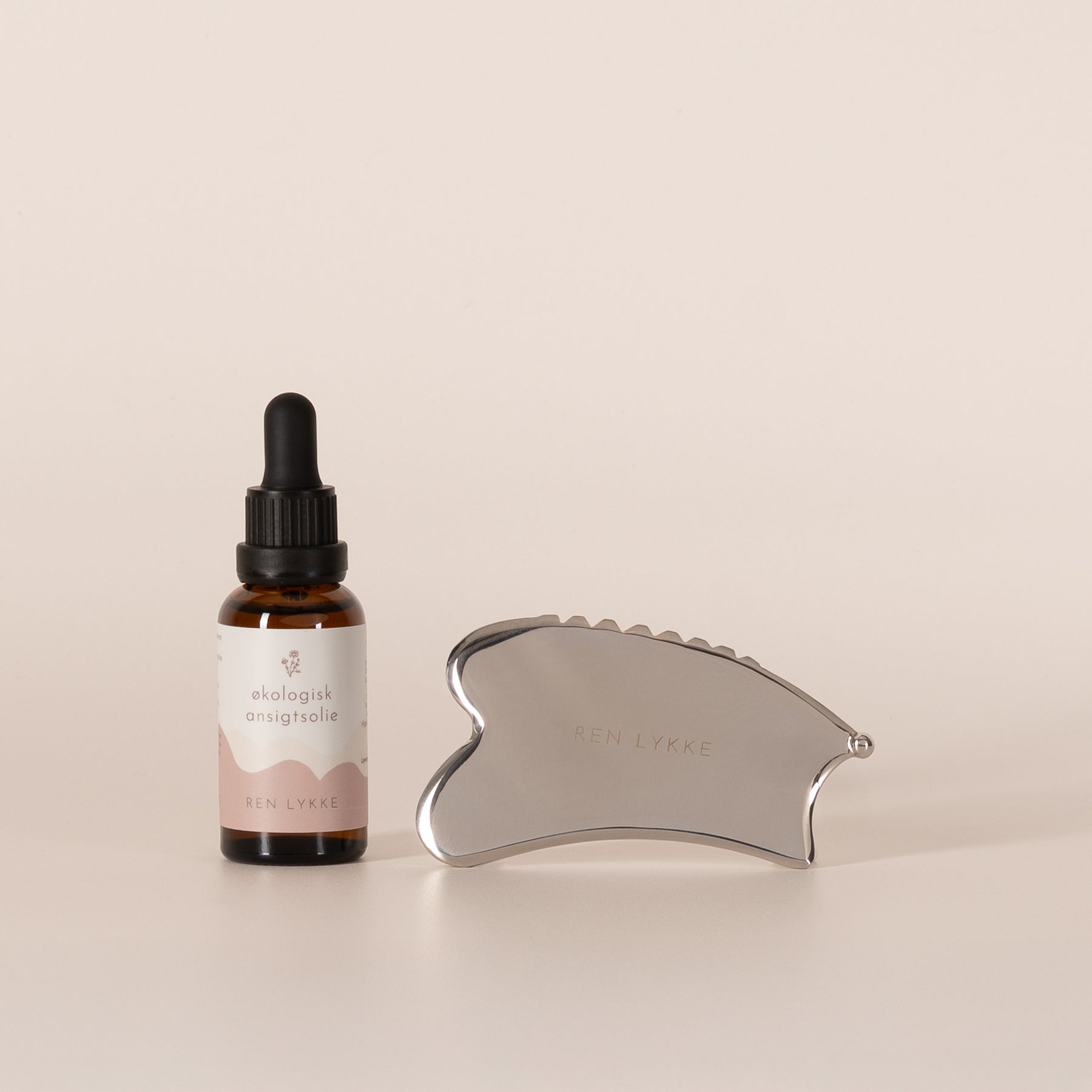 REN LYKKE pakke med gua sha og ansigtsolie