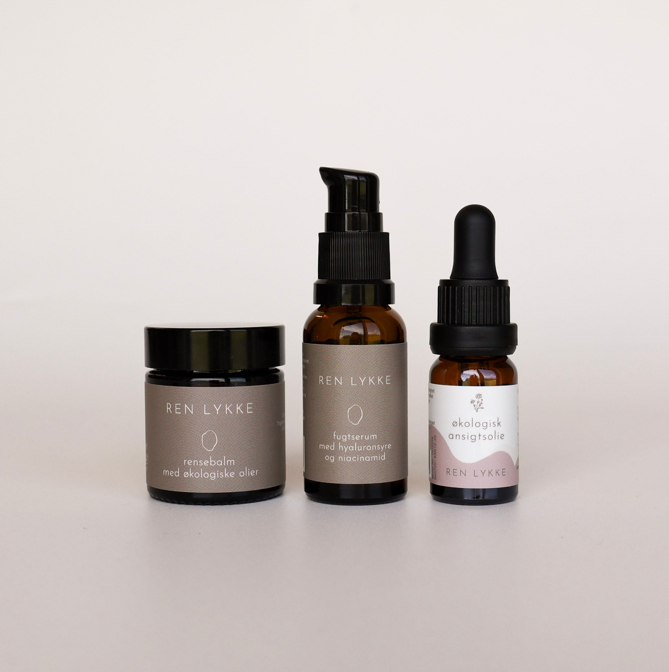 Rejsepakke med rensebalm, fugtserum og økologisk ansigtsolie fra REN LYKKE
